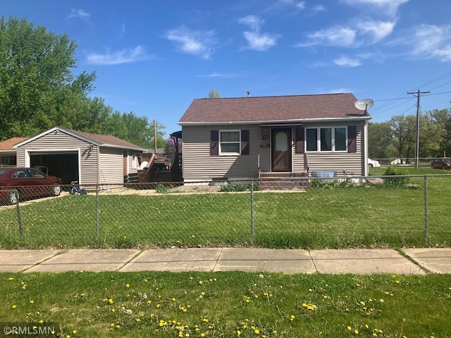 view of front of property featuring a detached garage and roof with shingles