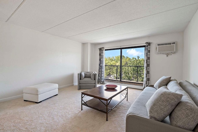 living room featuring baseboards, carpet, baseboard heating, and an AC wall unit
