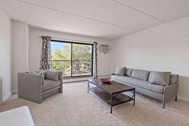 living area with light carpet, a baseboard radiator, a textured ceiling, a wall mounted AC, and baseboards