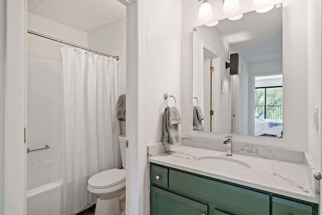 full bathroom featuring toilet, vanity, and shower / tub combo with curtain