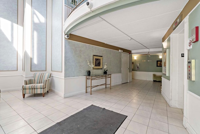community lobby featuring a wainscoted wall