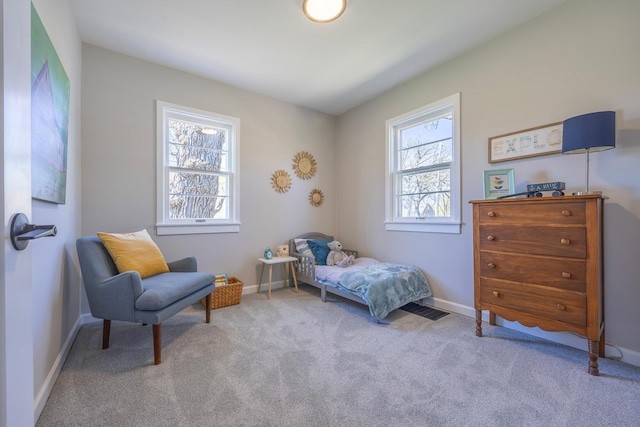 carpeted bedroom with baseboards