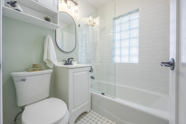 bathroom featuring toilet, bathing tub / shower combination, and vanity