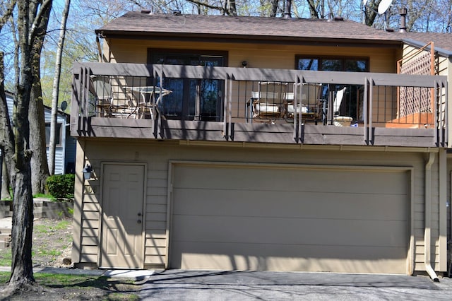 109 Eagle Lake Dr, Maple Grove, MN 55369 - rear view of house with a balcony and a garage