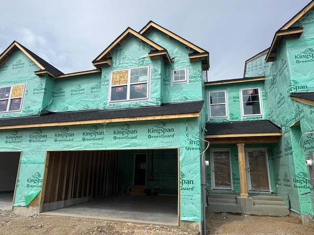 property in mid-construction with an attached garage