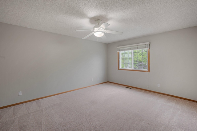 8497 Cortland Rd, Eden Prairie, MN 55344 - unfurnished room featuring light colored carpet, ceiling fan, baseboards, and a textured ceiling
