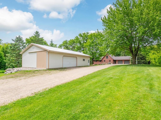 71156 Csah 18, Collinwood Twp, MN 55325 - view of front of house featuring a garage, an outdoor structure, and a front yard