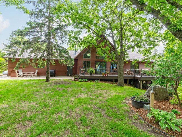 71156 Csah 18, Collinwood Twp, MN 55325 - view of grassy yard with a deck and a patio