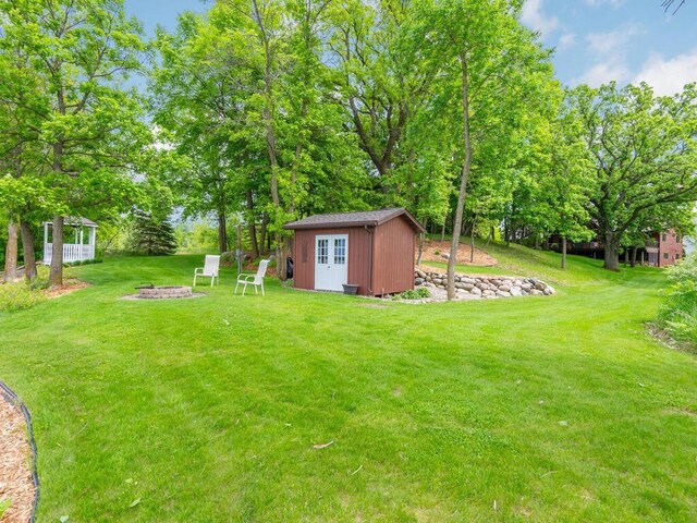 71156 Csah 18, Collinwood Twp, MN 55325 - view of green lawn featuring an outdoor fire pit
