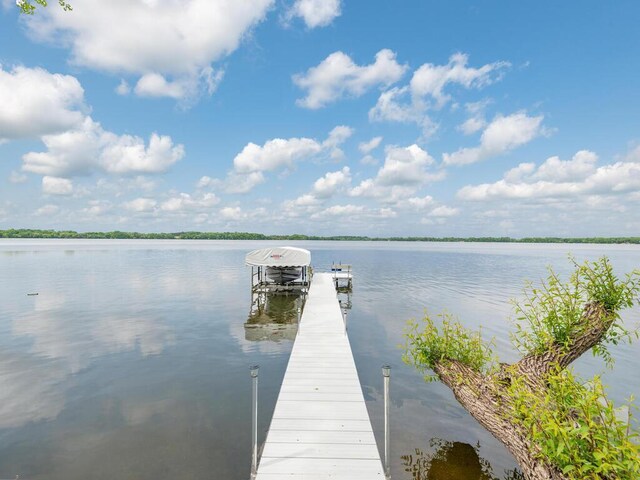 71156 Csah 18, Collinwood Twp, MN 55325 - dock area featuring a water view and boat lift
