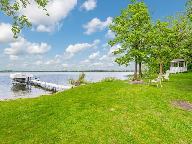 71156 Csah 18, Collinwood Twp, MN 55325 - dock with a water view, a lawn, and boat lift