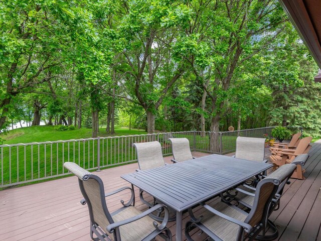 71156 Csah 18, Collinwood Twp, MN 55325 - wooden terrace with outdoor dining area and a yard