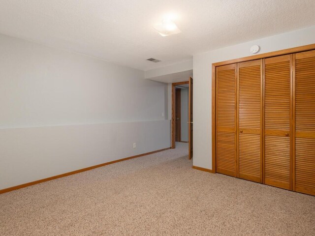 71156 Csah 18, Collinwood Twp, MN 55325 - unfurnished bedroom featuring carpet floors, a closet, and baseboards