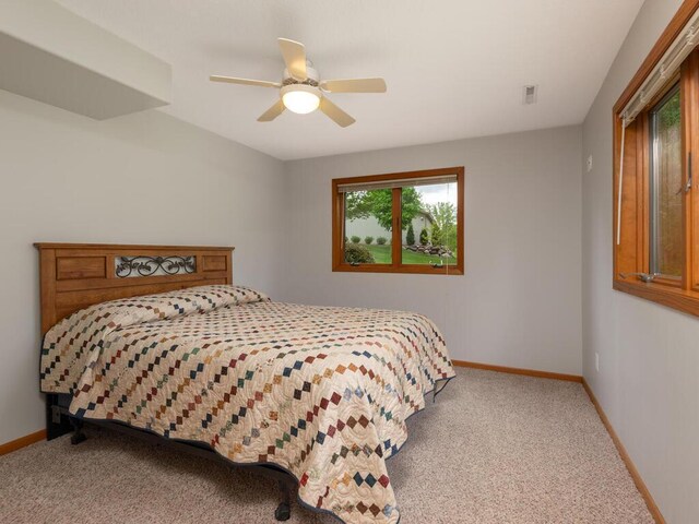 71156 Csah 18, Collinwood Twp, MN 55325 - carpeted bedroom with baseboards and a ceiling fan