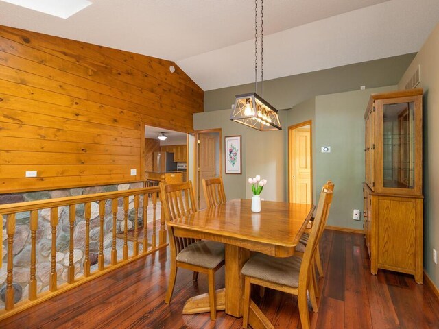71156 Csah 18, Collinwood Twp, MN 55325 - dining room with vaulted ceiling, wooden walls, hardwood / wood-style flooring, and baseboards