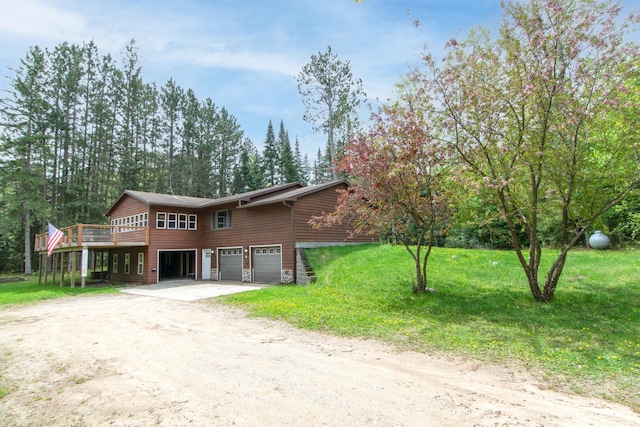 51850 Scenic Hwy Unit 7, Bigfork, MN 56628 - view of front of property featuring a garage, dirt driveway, a wooden deck, and a front lawn
