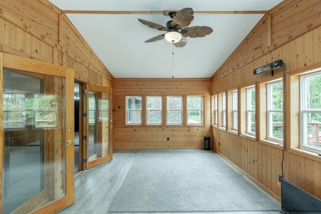 51850 Scenic Hwy Unit 7, Bigfork, MN 56628 - unfurnished sunroom featuring vaulted ceiling, wooden walls, plenty of natural light, and wood finished floors