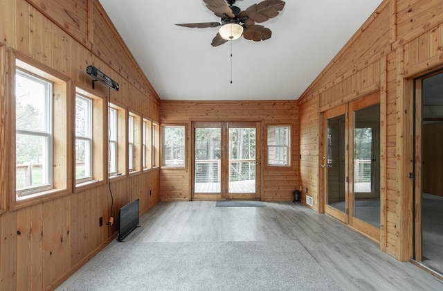 51850 Scenic Hwy Unit 7, Bigfork, MN 56628 - unfurnished sunroom with vaulted ceiling, wood walls, and wood finished floors