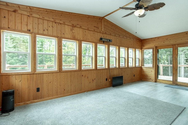 51850 Scenic Hwy Unit 7, Bigfork, MN 56628 - unfurnished sunroom featuring lofted ceiling, plenty of natural light, wooden walls, and carpet floors