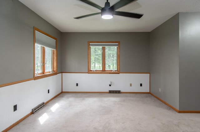 51850 Scenic Hwy Unit 7, Bigfork, MN 56628 - empty room featuring ceiling fan, light carpet, and baseboards
