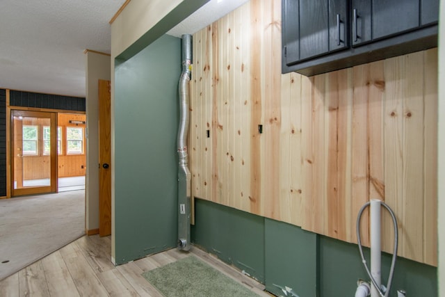 51850 Scenic Hwy Unit 7, Bigfork, MN 56628 - washroom featuring wood finished floors and cabinet space