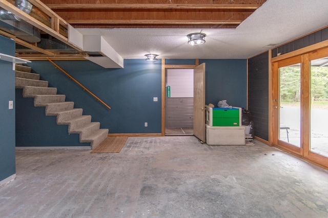 51850 Scenic Hwy Unit 7, Bigfork, MN 56628 - foyer with concrete flooring, baseboards, and stairway