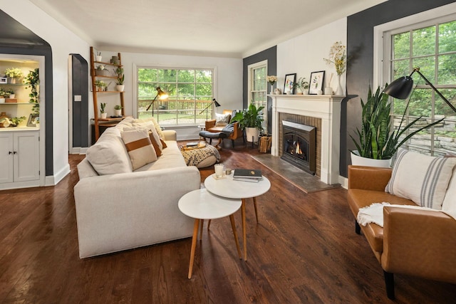 1112 Vincent Ave S, Minneapolis, MN 55405 - living area with a fireplace, dark wood-style floors, and baseboards