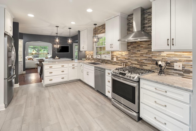 1112 Vincent Ave S, Minneapolis, MN 55405 - kitchen with stainless steel appliances, wall chimney range hood, a sink, open floor plan, and recessed lighting