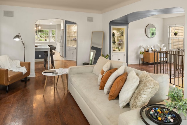 1112 Vincent Ave S, Minneapolis, MN 55405 - living area featuring arched walkways, wood finished floors, and baseboards