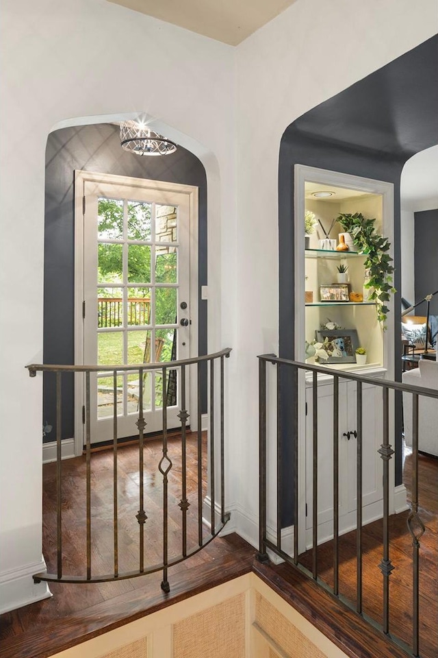 1112 Vincent Ave S, Minneapolis, MN 55405 - doorway to outside with arched walkways, wood finished floors, and baseboards
