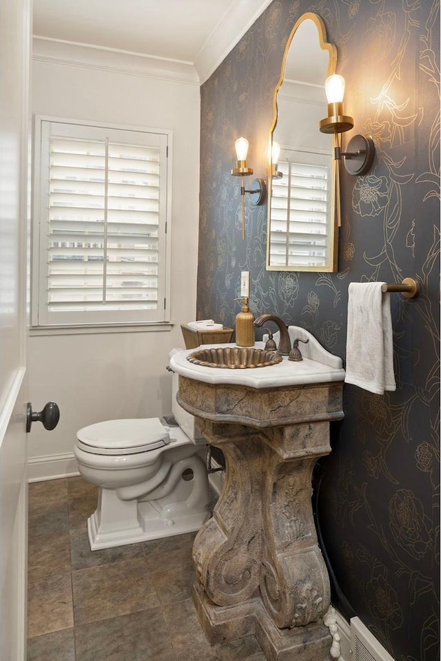 1112 Vincent Ave S, Minneapolis, MN 55405 - bathroom with toilet, plenty of natural light, crown molding, and baseboards