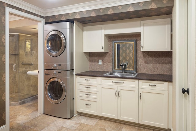 1112 Vincent Ave S, Minneapolis, MN 55405 - laundry area featuring stacked washer / drying machine, a sink, light stone finish floors, and crown molding