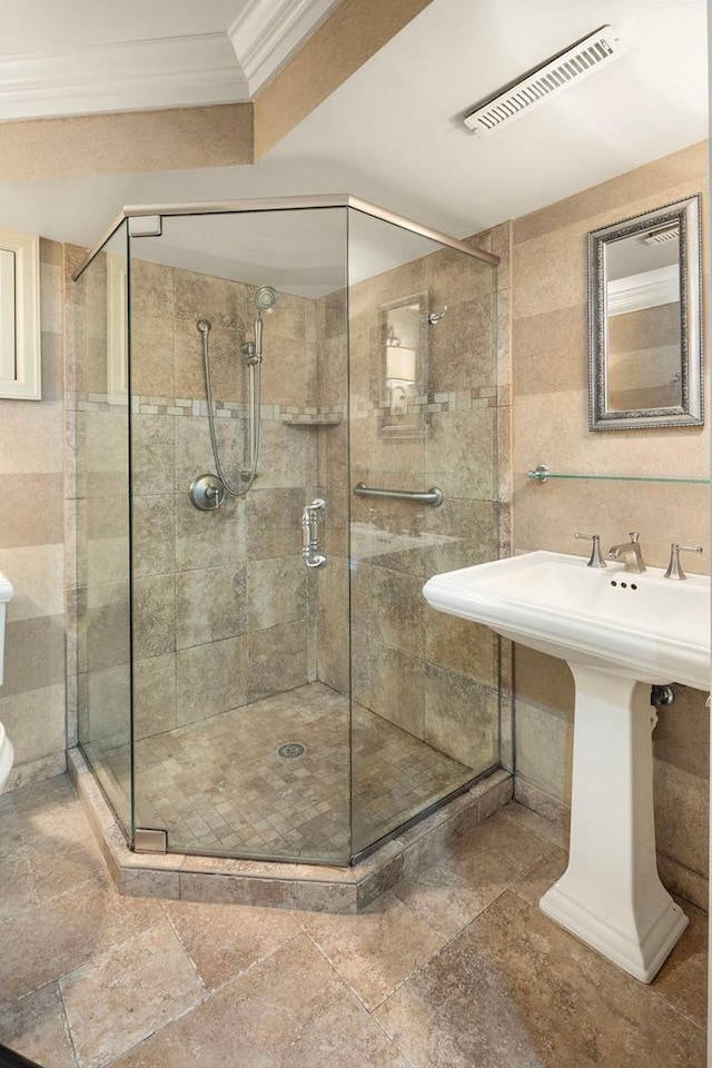 1112 Vincent Ave S, Minneapolis, MN 55405 - full bath with a shower stall, ornamental molding, and toilet