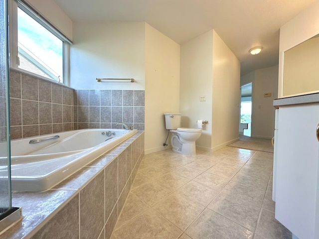 1976 Bay St, Worthington, MN 56187 - full bathroom with tile patterned floors, a garden tub, toilet, and baseboards