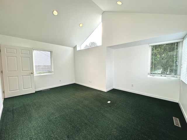 1976 Bay St, Worthington, MN 56187 - carpeted empty room featuring baseboards, recessed lighting, and high vaulted ceiling