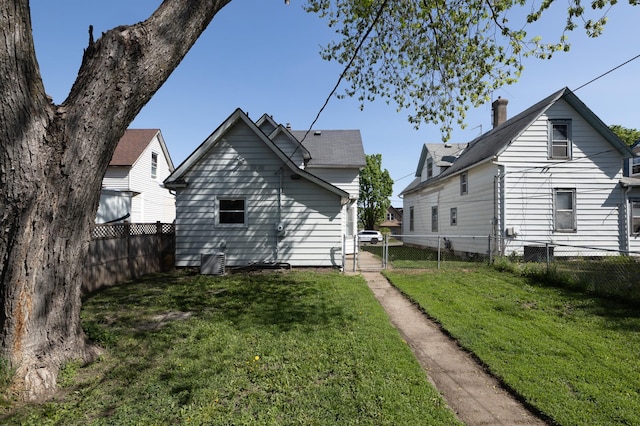 back of property featuring a gate