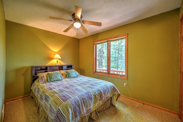 27166 Hersant Rd, Meenon Twp, WI 54893 - bedroom featuring carpet flooring, baseboards, a ceiling fan, and a textured ceiling