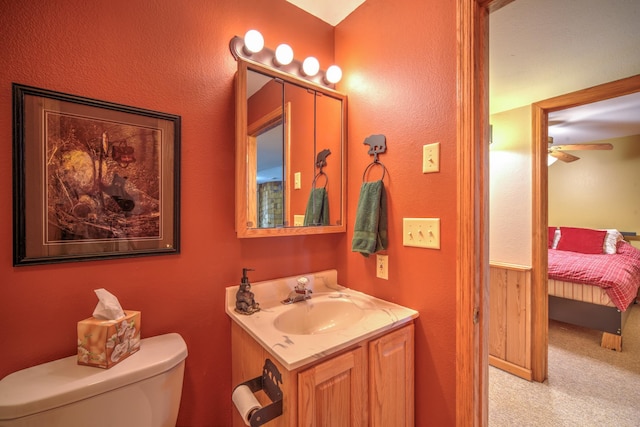 27166 Hersant Rd, Meenon Twp, WI 54893 - half bathroom featuring ensuite bath, vanity, toilet, and a ceiling fan