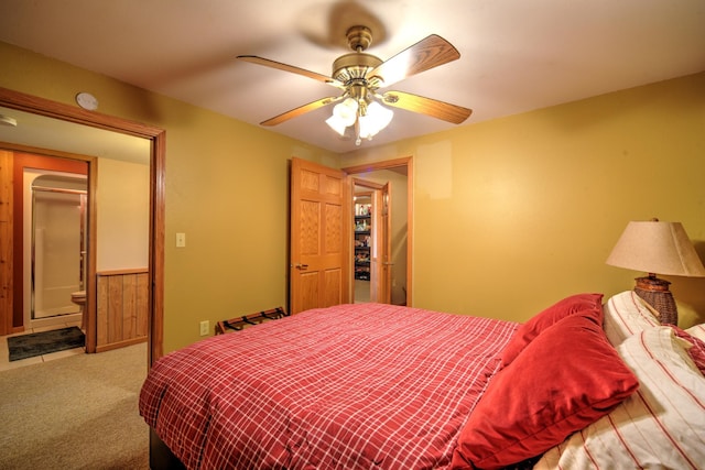 27166 Hersant Rd, Meenon Twp, WI 54893 - carpeted bedroom with a ceiling fan and connected bathroom