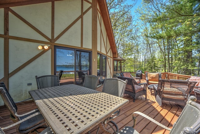 27166 Hersant Rd, Meenon Twp, WI 54893 - wooden terrace featuring outdoor dining area and an outdoor living space