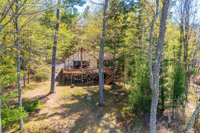 27166 Hersant Rd, Meenon Twp, WI 54893 - view of yard with a wooden deck, stairway, and a forest view