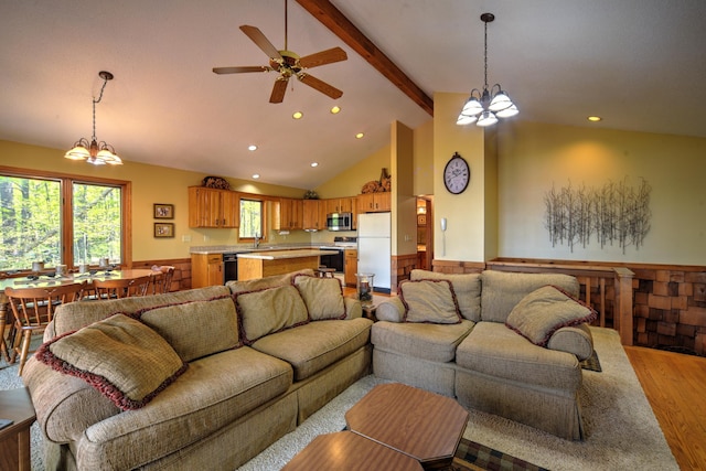 27166 Hersant Rd, Meenon Twp, WI 54893 - living area featuring light wood-type flooring, a chandelier, beamed ceiling, recessed lighting, and ceiling fan