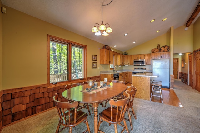 27166 Hersant Rd, Meenon Twp, WI 54893 - dining room with light carpet, wainscoting, a chandelier, lofted ceiling, and recessed lighting