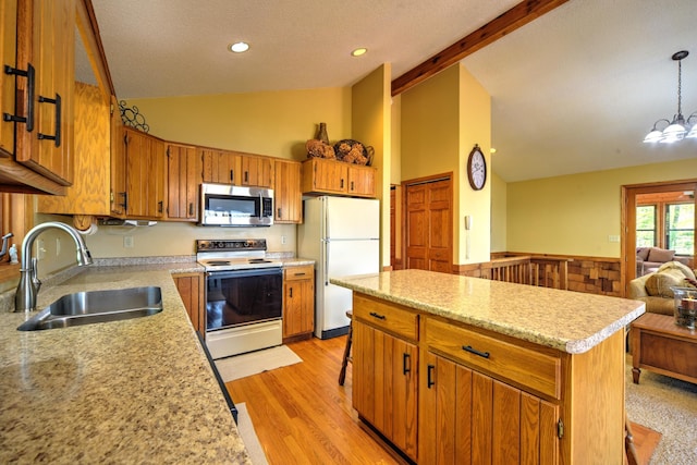 27166 Hersant Rd, Meenon Twp, WI 54893 - kitchen with white appliances, a sink, high vaulted ceiling, light countertops, and open floor plan