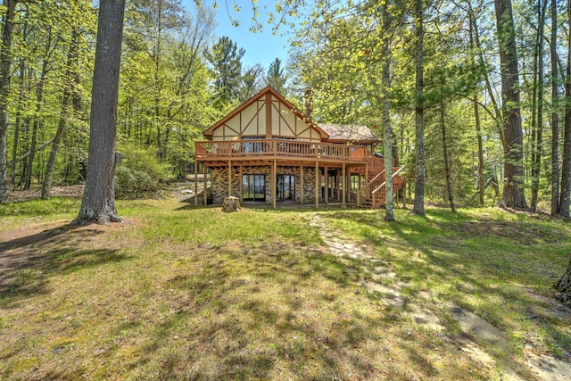 27166 Hersant Rd, Meenon Twp, WI 54893 - rear view of house with a wooden deck, stairway, and a lawn