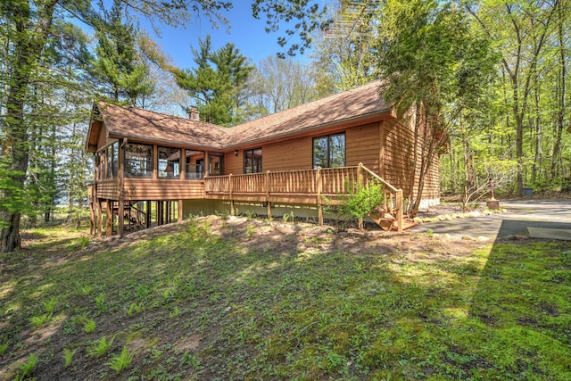 27166 Hersant Rd, Meenon Twp, WI 54893 - back of property featuring a chimney, stairway, and a deck