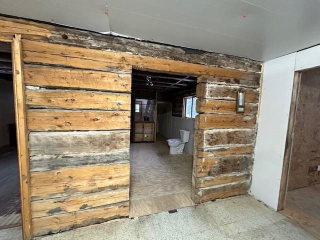5535 Wahlsten Rd, Embarrass, MN 55732 - below grade area featuring wood walls and tile patterned floors