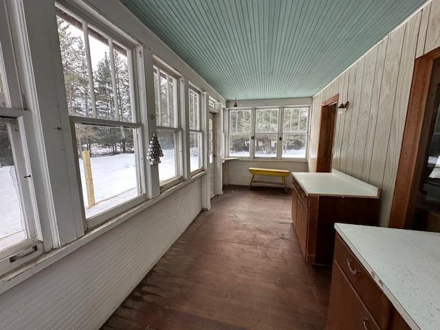 5535 Wahlsten Rd, Embarrass, MN 55732 - unfurnished sunroom with wood finished floors and wood walls