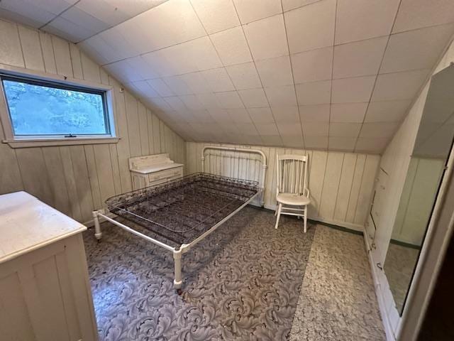 5535 Wahlsten Rd, Embarrass, MN 55732 - bedroom featuring vaulted ceiling, carpet floors, and wood walls
