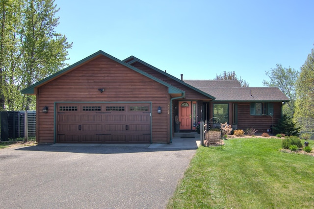 view of front of property with driveway and an attached garage